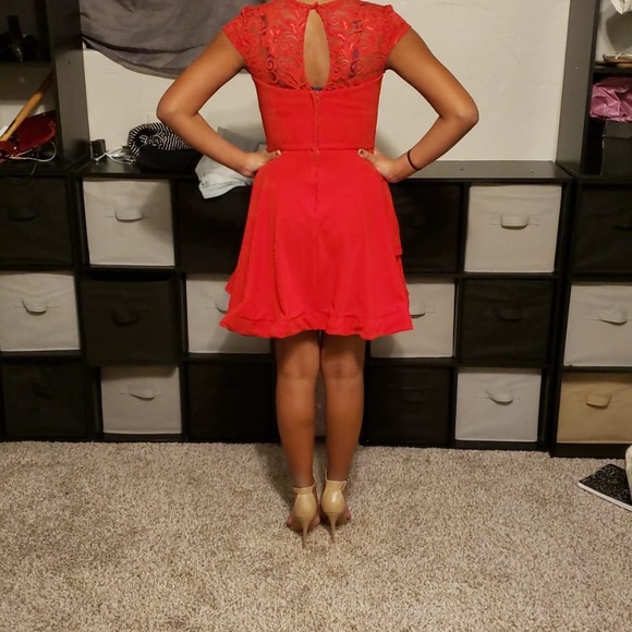 A red dress with lace accents - Picture 4 of 4